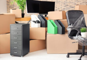 Room with cardboard boxes and office furniture